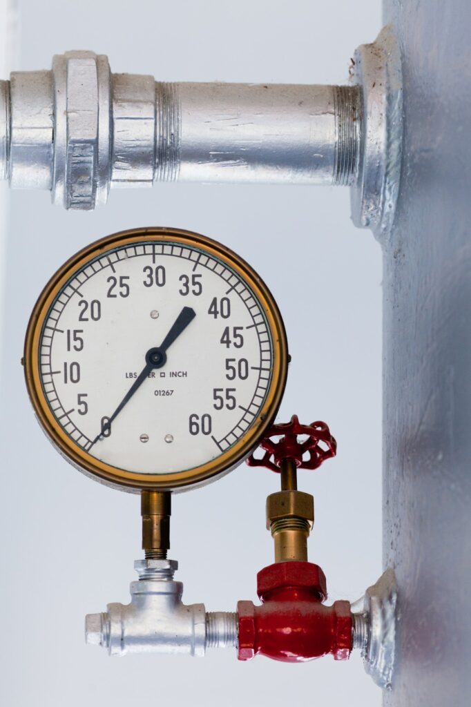 Steampunk metal pressure gauge on boiler tank